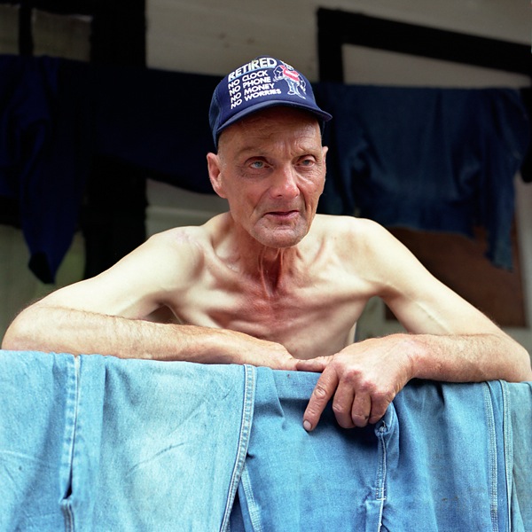 Elder Man in front of clothesline